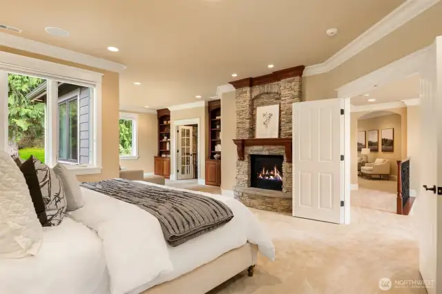Private and luxurious Primary Suite with double door entry and cozy gas fireplace