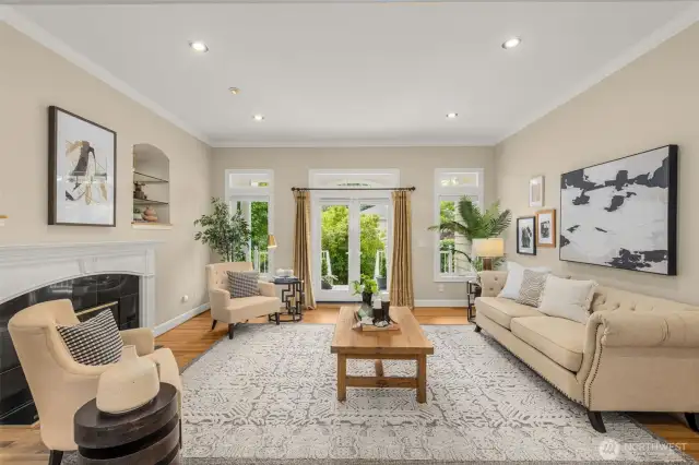 Spacious living room with french doors out to the wrap around covered back deck
