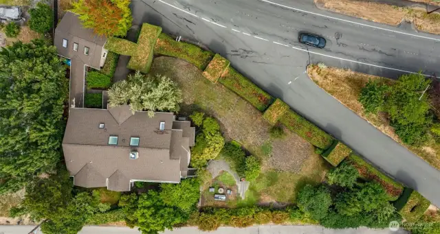 This aerial view shows the size of the property and that amazing privacy hedge