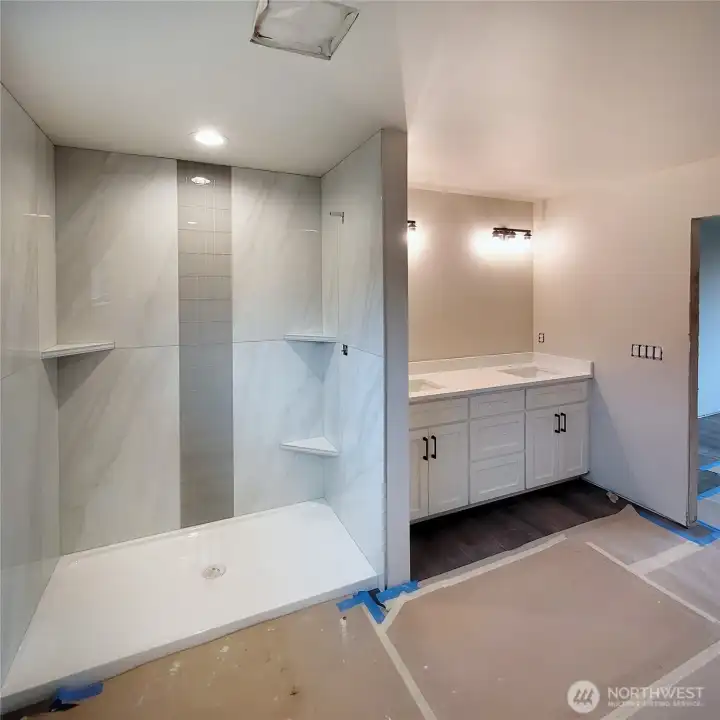 Walk in tile shower, double vanity!