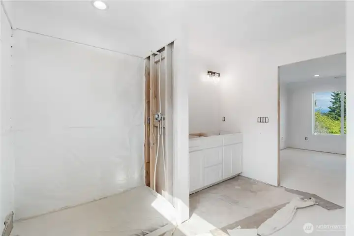 Walk in tile shower & double vanity.