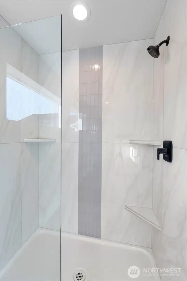 3 niches in the custom tile shower.