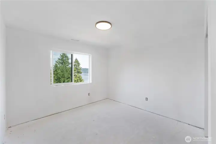 Bedroom 1 upstairs with views of the Hood Canal.