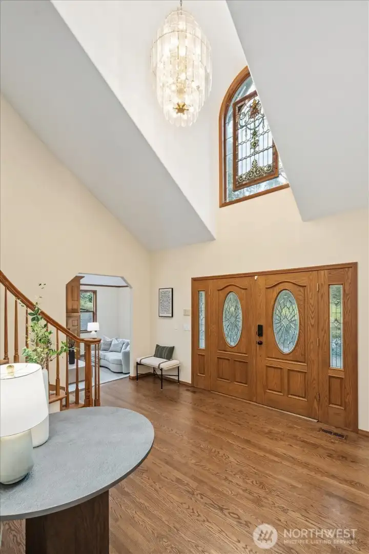 Gorgeous hardwood floors and soaring entryway