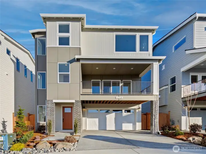 The Glacier Home Plan. All photos, renderings, site maps, and floorplans are for visualization purposes only. Plans, colors, building orientation, finishes, home outlook, and other details can and WILL vary. Striking three-level Glacier plan showcases a modern Craftsman façade with brick accents, vertical siding, and oversized windows for maximum natural light. Covered balcony and welcoming entry set the tone for refined living in Bothell’s Foxmoore community, close to Canyon Park conveniences and I-405 access.