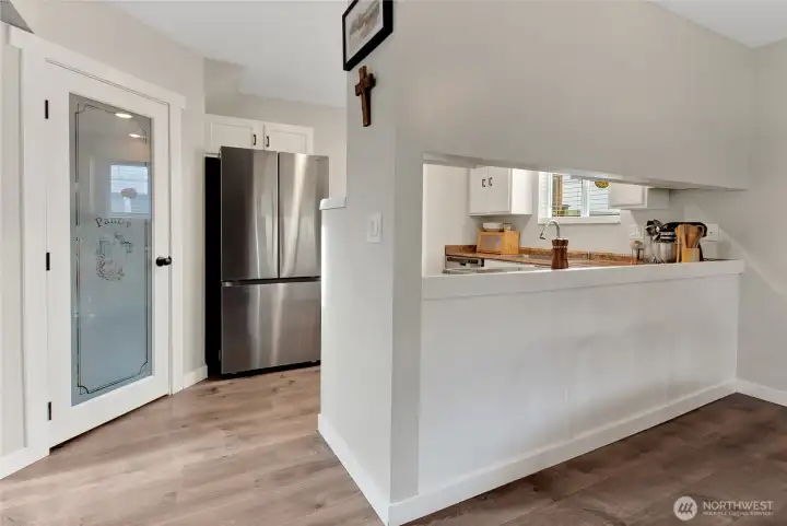 Pantry, kitchen with stainless appliances