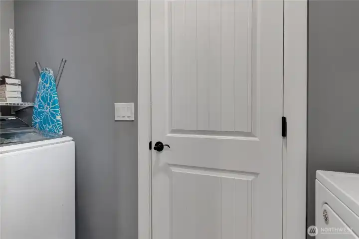 Laundry room with door leading to garage