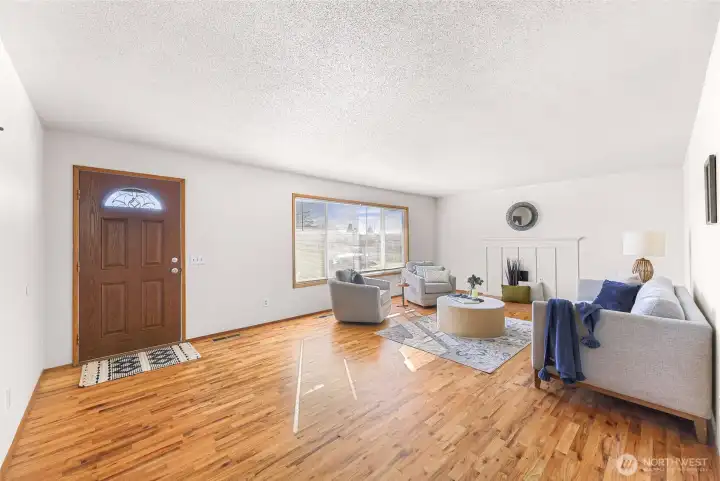 Large living room with original oak floors