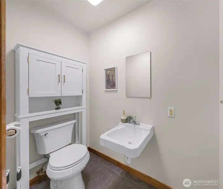 Handy half bath off of the laundry room