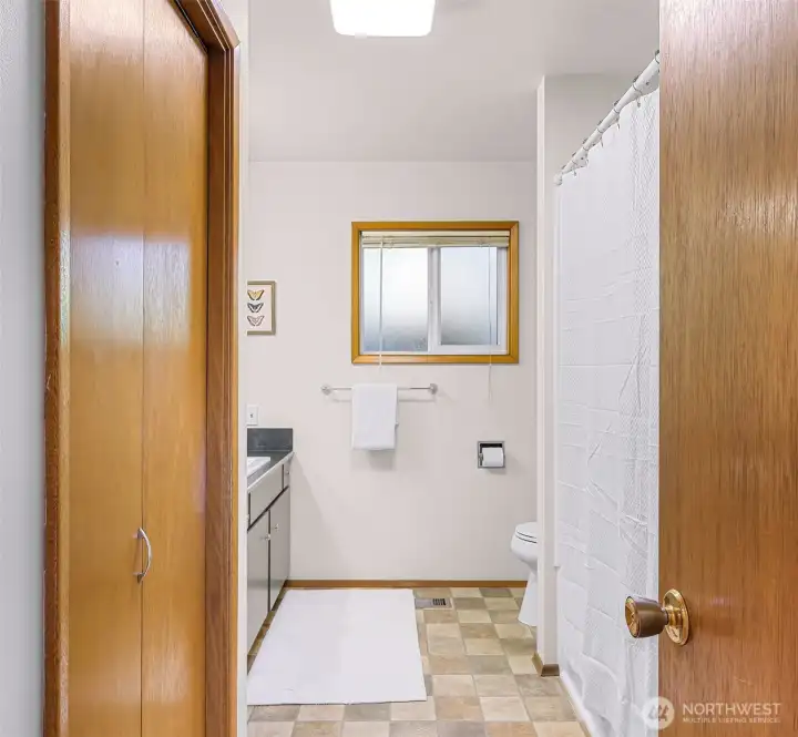 Bathroom with new tub/shower surround.