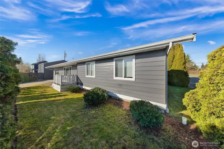 Front yard protected by mature landscaping.