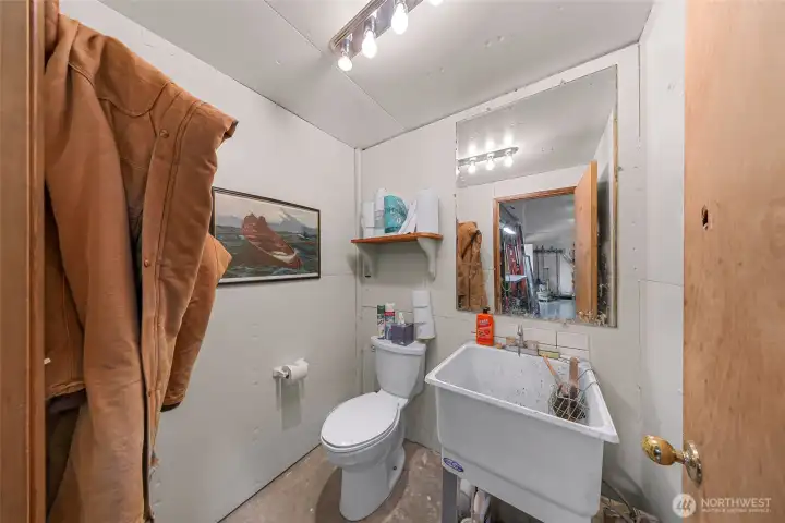Half bath in the shop with deep utility sink