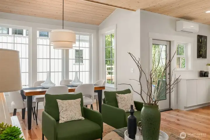 The dining room seats dinner for 8 and overlooks a fenced rear yard.  The rear door flows from the kitchen to rear deck and barbeque space.