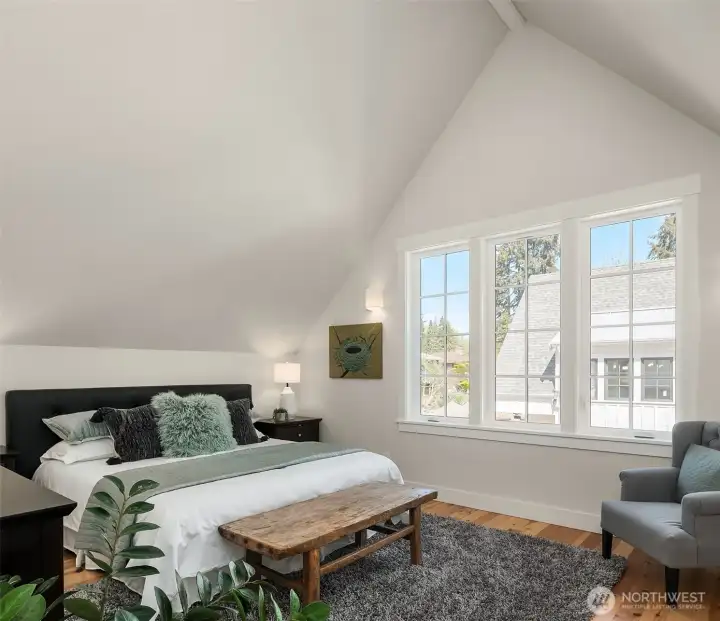 One of two large, vaulted ceiling bedrooms, both with huge closets! Solid wood floors throughout, heating and cooling provided by Mitsubishi mini splits.  ERV provides constant air filtration to insure indoor air quality.