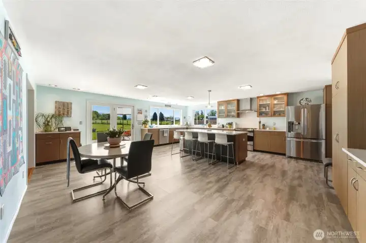 Kitchen with new cabinets, counters and vinyl plank flooring
