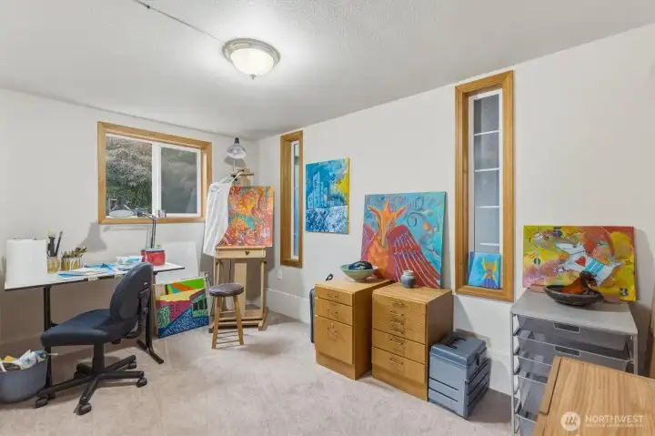Downstairs artist retreat or home office.
