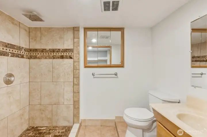 ADU bath with step in shower