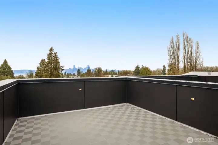 Step out onto the expansive private deck, an ideal perch for morning coffee or evening sunsets while taking in the fresh air and neighborhood views