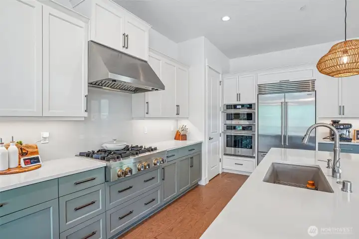 Kitchen with Gas range, oversize refriderator, oven and island Kitchen with Gas range, oversize refriderator, oven and island