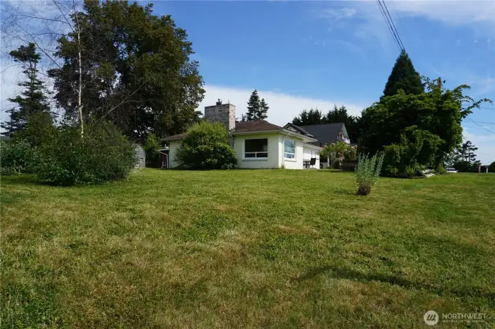Great location! 1440 square feet of living area. Large .38 acre land. Extra outbuildings, fruit trees, some fencing, tons of on site parking. Covered carport, 2 driveways. Power, water sewer, natural gas at the street and connected to the house. Live in the house while you finish the remodel. Make it your own!