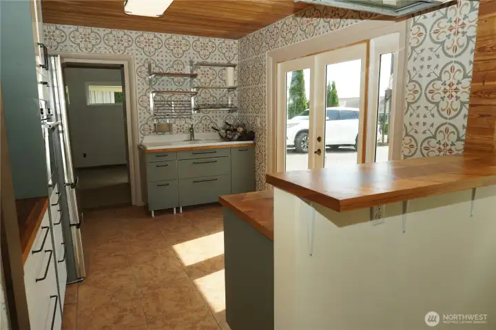 Kitchen with a gas stove, oven, refrigerator and plenty of storage.
