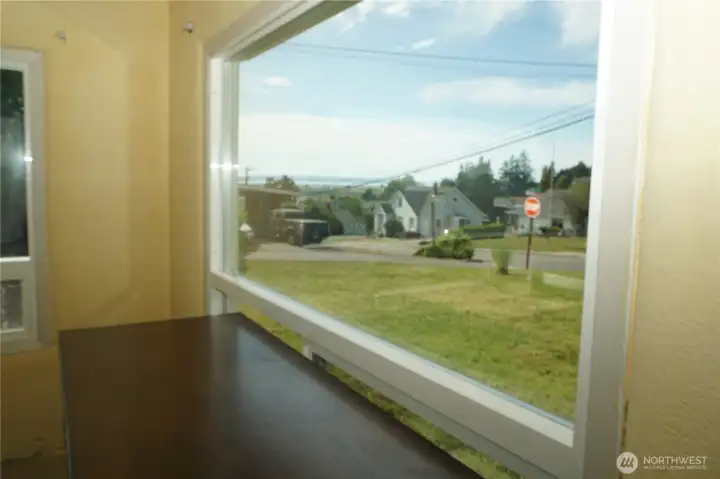 Large windows with sliding bottom windows for open air breezes. Sunset and distant water bay views.