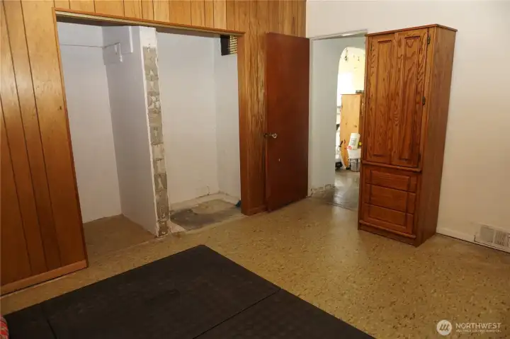 Twin unfinished closets in the second room.
