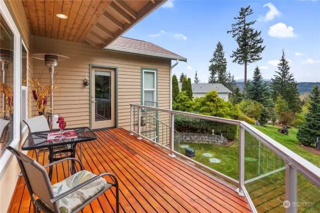Great exterior deck with spiral staircase leading to the lower lawn.