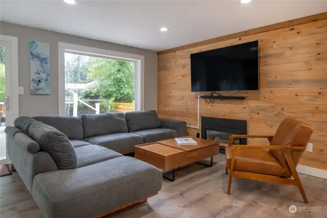 Living room with shiplap accent wall.