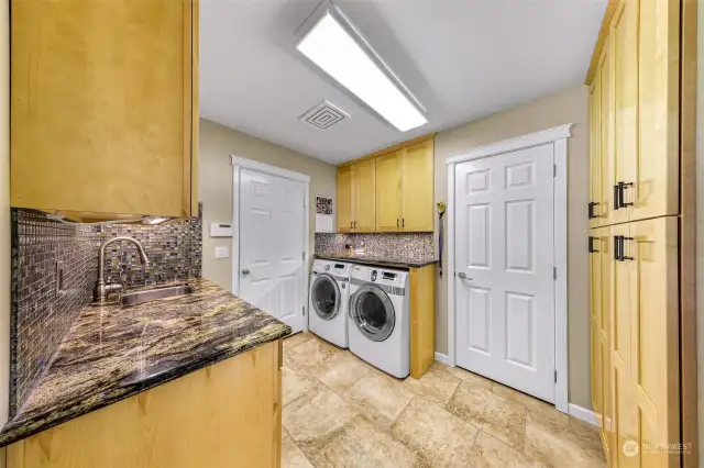 Large Laundry room with extra toilet.