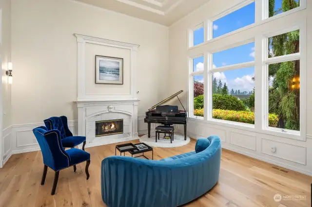 The formal living room offers high ceilings, large picture windows and French doors that lead to the private hot tub patio.