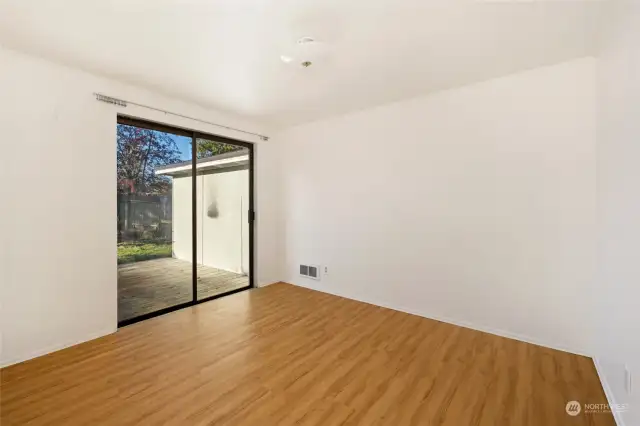2nd bedroom that opens up to the back deck and siza
