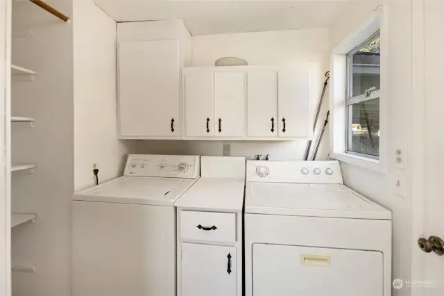 Laundry/mudroom with direct access to the carport.