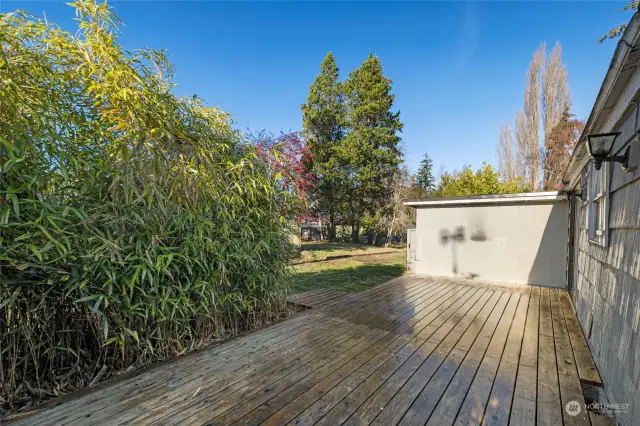 Large deck with privacy landscaping.