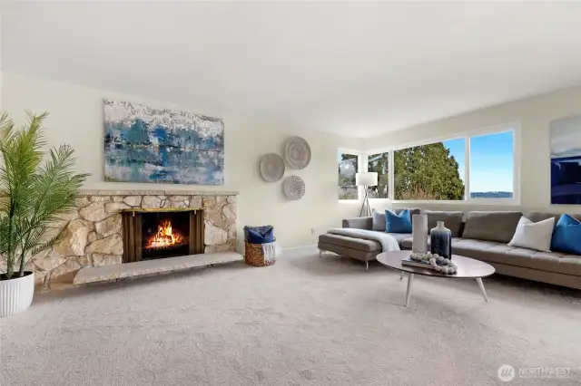 Living room features a wood-burning fireplace and new carpet and paint.