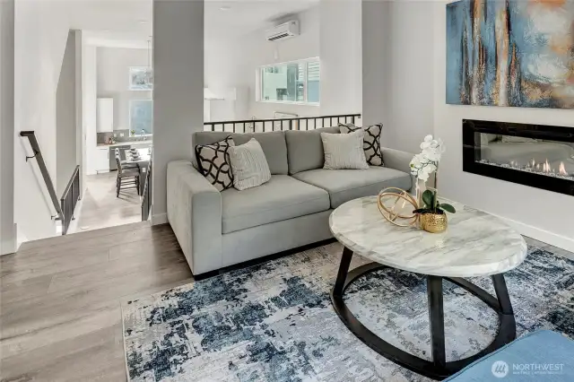 Two tiered dining and living space with electric fireplace (model home lot 24)