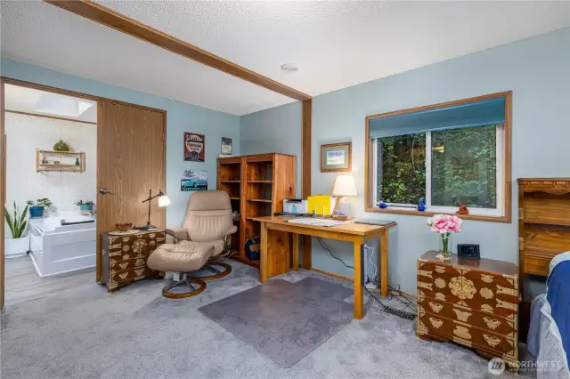 Primary bedroom offers plenty of room for a desk or reading nook, creating a peaceful retreat for both work and relaxation