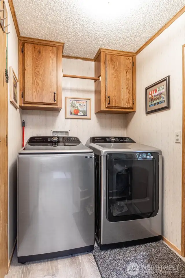 Updated washer & dryer inside laundry room that also acts as a mudroom