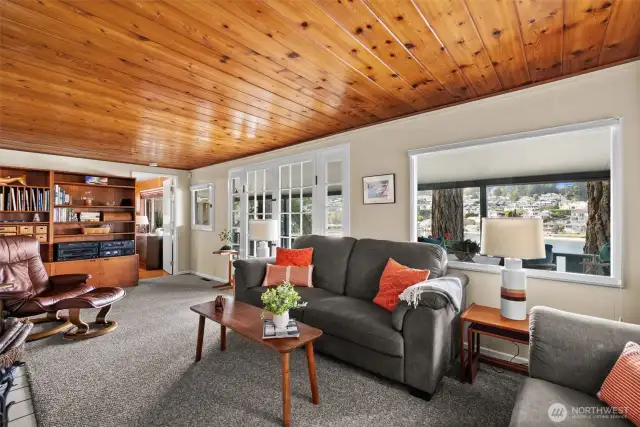 A beautiful tongue-and-groove pine ceiling evokes a sense of nostalgia and timeless charm.