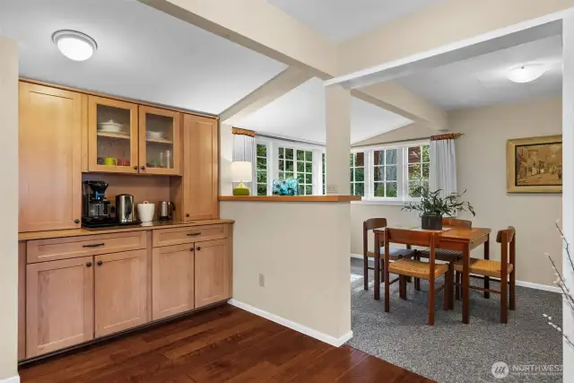 A floor-to-ceiling built-in cabinet offers extra storage and the perfect spot for a wine or coffee center.