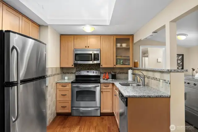 An oversized skylight bathes the kitchen in natural light, creating a bright and cheerful atmosphere.