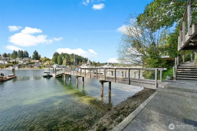 An impressive 135-ft deepwater dock, complete with a 45-ft concrete float, capable of accommodating a 7-ft draft at a -3.5 tide