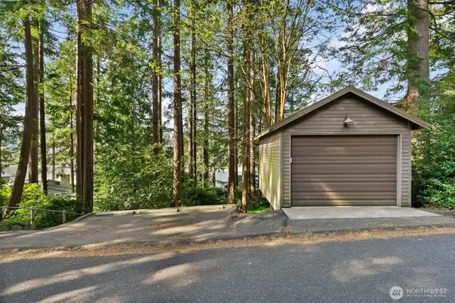 One covered garage is located off Goodman Drive and includes a concrete pad for additional parking.