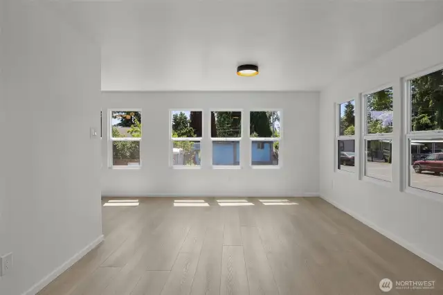 Living area surrounded by 2 walls of windows