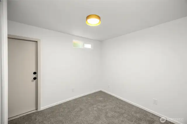3rd bedroom at north end of the home. This door leads out to the back deck.