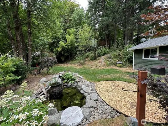 Amazing water feature in the front yards provides a peaceful place to relax