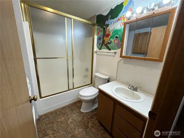 Hall bathroom with the laundry