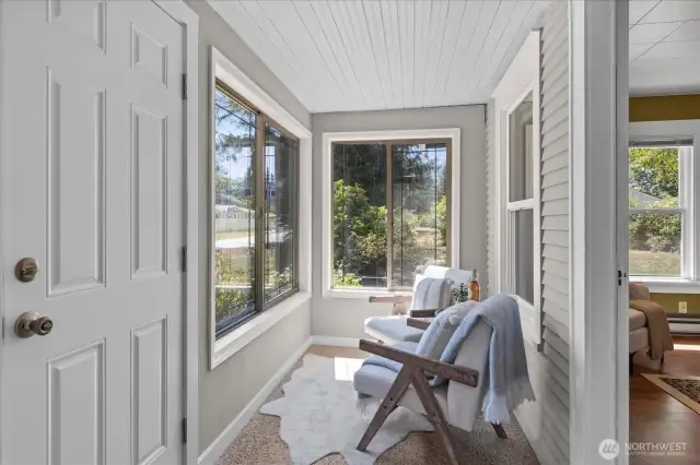 Sunny, enclosed front porch for sitting ...
