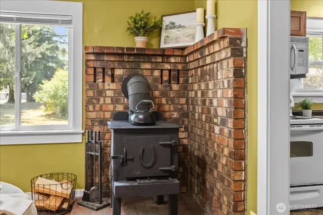 Woodstove with classic brick surround.