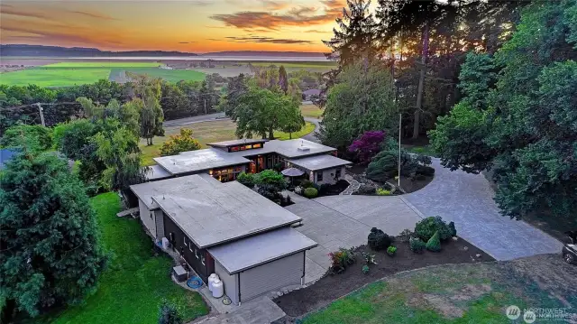 Aerial. view looking west at the sunset.